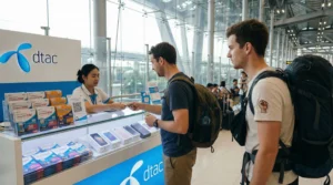 Tourist buying prepaid SIM card at Bangkok airport Thailand