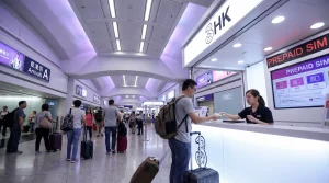 Tourist buying prepaid SIM card at Hong Kong International Airport