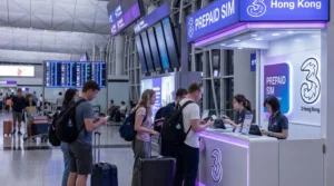 Tourists buying prepaid SIM cards at Hong Kong International Airport arrivals hall