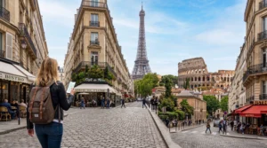 tourist using mobile internet esim while traveling across europe landmarks