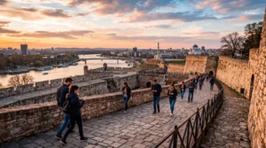 tourists using smartphones with mobile internet at kalemegdan fortress belgrade