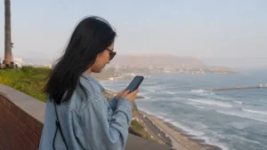 Traveller using a smartphone in Peru for internet lima tourists