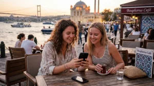 Travelers using WhatsApp and mobile internet in Turkey.
