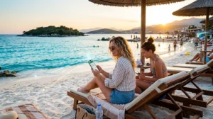 Tourists using mobile internet and eSIM connectivity while traveling in Ksamil, Albania.