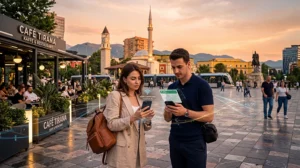 Tourists using mobile internet and eSIM connectivity while traveling in Tirana, Albania.
