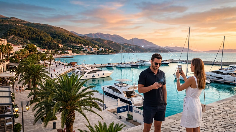 Tourists using mobile internet and eSIM connectivity while traveling in Vlorë, Albania.