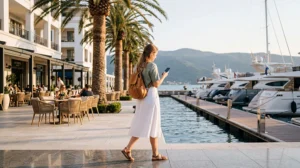 Traveler using an eSIM while exploring Tivat and Porto Montenegro