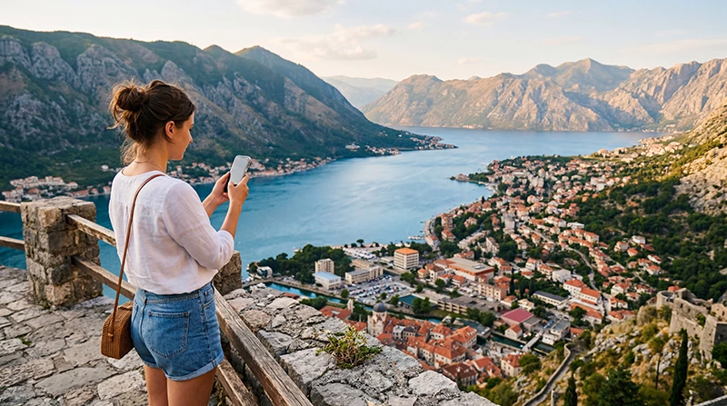 Traveler using mobile data while exploring Montenegro
