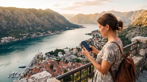 Tourist setting up mobile internet on a smartphone while visiting Montenegro
