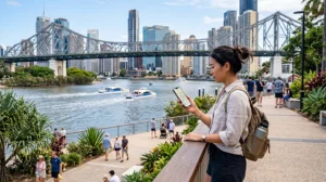 Tourist using mobile internet while exploring Brisbane Australia