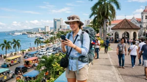 Tourist using mobile internet while exploring Cebu in the Philippines
