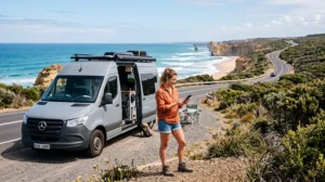 Traveler using mobile internet during a campervan trip across Australia