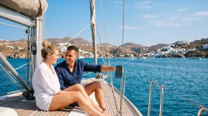 Traveler using mobile internet while sailing around the Greek Islands