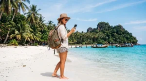 Traveler using mobile internet while visiting tropical islands in Malaysia