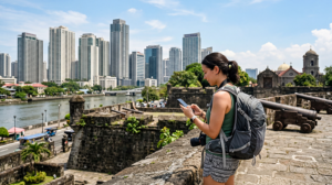 Tourist using mobile internet while exploring Manila in the Philippines