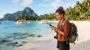 Tourist using mobile internet on a smartphone while traveling through the Philippines