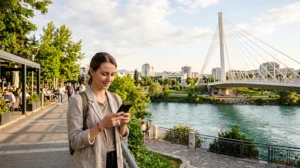 Tourist using mobile internet while exploring Podgorica in Montenegro