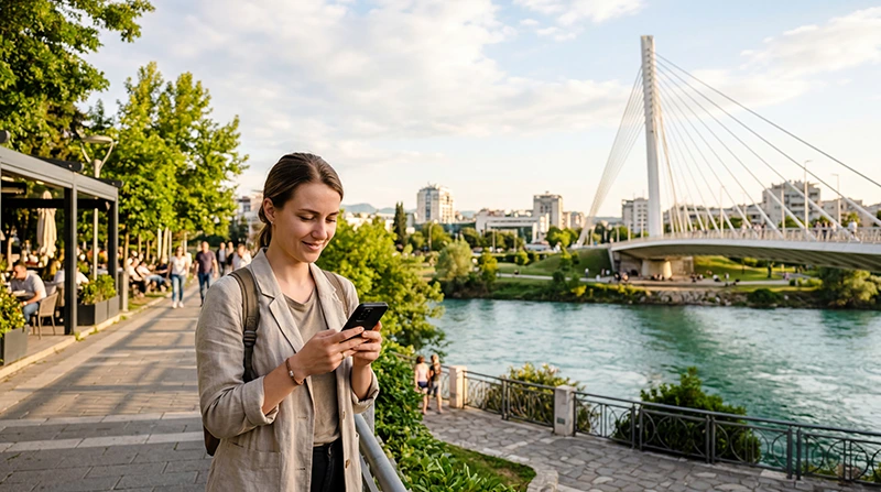Tourist using mobile internet while exploring Podgorica in Montenegro