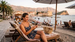 Tourist using mobile data with an eSIM while visiting Budva in Montenegro