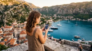 Traveler using mobile data while visiting Kotor in Montenegro