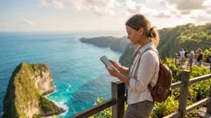 Traveler using unlimited data eSIM on a smartphone while traveling across Bali, Lombok and Indonesia