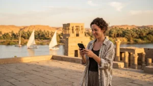 Tourist using an eSIM for mobile internet while visiting Aswan Egypt