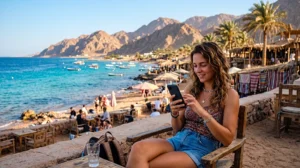 Tourist using an eSIM for mobile internet while visiting Dahab Egypt