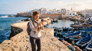 Tourist using an eSIM for mobile internet in Essaouira Morocco
