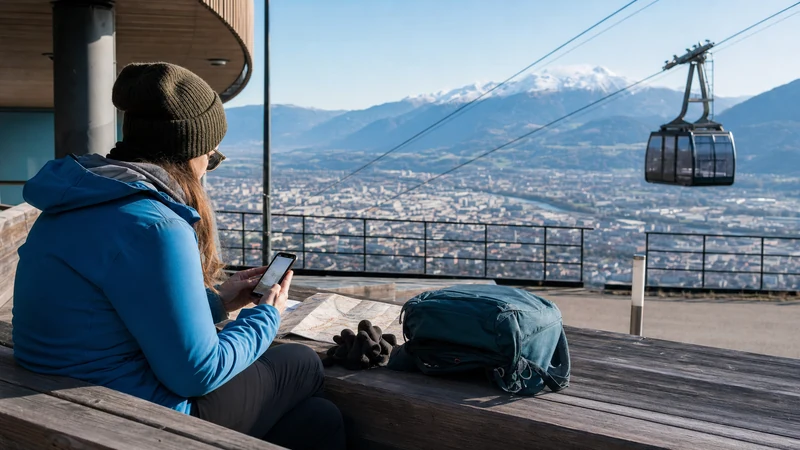 Traveller choosing an eSIM plan in central Innsbruck