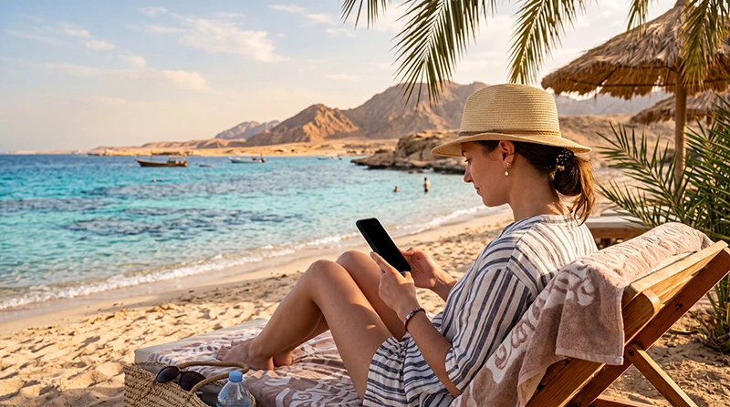 Tourist using an eSIM for mobile internet while visiting Marsa Alam Egypt