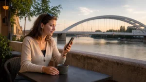 Traveller using a smartphone in central Szeged, Hungary
