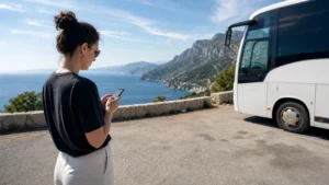 Coach passenger checking mobile data on the Dubrovnik to Split route.