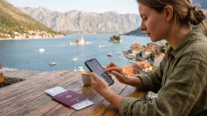 Traveler installing a Montenegro eSIM before departure