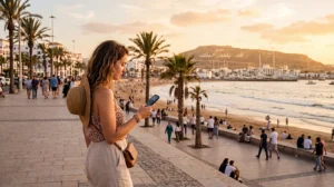 Tourist using mobile internet in Agadir Morocco
