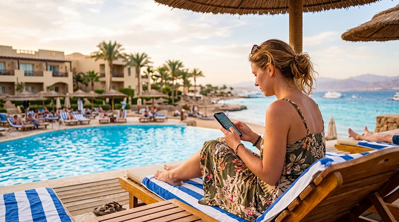 Tourist using mobile internet at a resort in Egypt