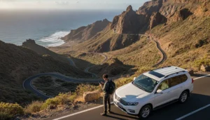Traveller using smartphone internet during a Gran Canaria road trip near mountain landscape