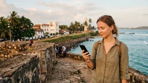 Tourist using mobile internet while exploring Galle Fort in Sri Lanka