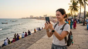 Tourist using mobile internet in Goa with an India eSIM