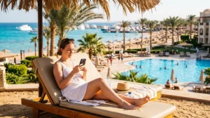 Tourist using mobile internet at a resort in Hurghada Egypt