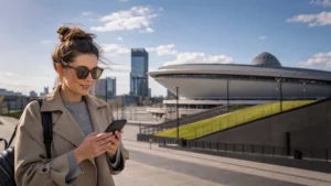 Traveller using mobile internet in central Katowice.