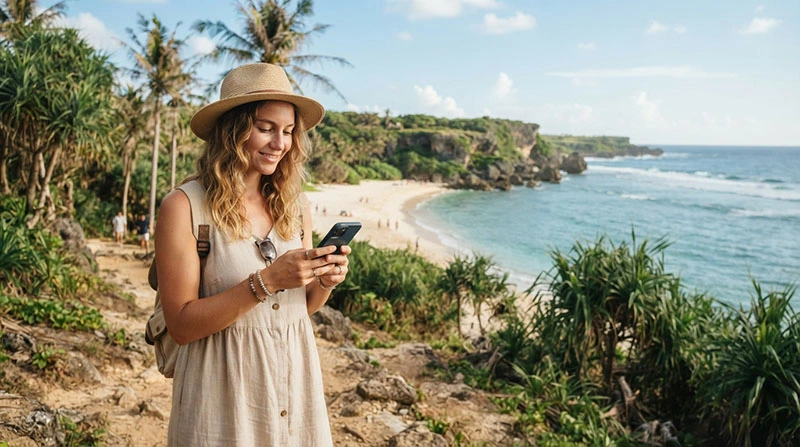Tourist using mobile internet while visiting Kenting National Park in Taiwan