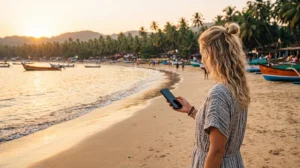 Tourist using mobile internet at Palolem Beach with an India eSIM
