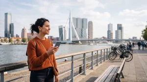 Tourist using mobile internet while exploring Rotterdam
