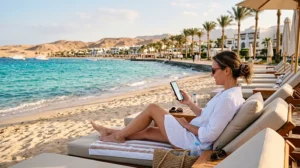 Tourist using mobile internet while visiting Sahl Hasheesh Egypt