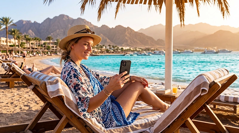 Tourist using mobile internet while visiting Sharm El Sheikh Egypt