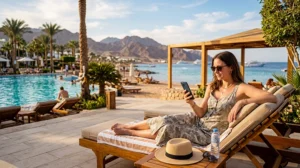 Tourist using mobile internet at a resort in Sharm El Sheikh Egypt