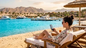 Tourist using mobile internet while visiting Soma Bay Egypt