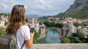 Traveller using a smartphone during manual network selection for a bosnia and herzegovina esim in Bosnia and Herzegovina.