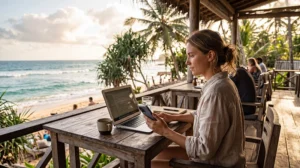 Remote worker using mobile internet while working from a beachfront café in Sri Lanka