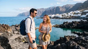 Couple using an unlimited data eSIM while exploring the volcanic coastline of the Canary Islands